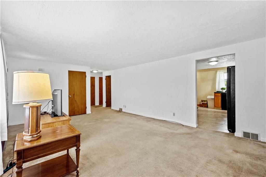 3406 McRoberts Road Pittsburgh, PA 15234 - Photo 4 of 19 a view of a livingroom with a flat screen tv