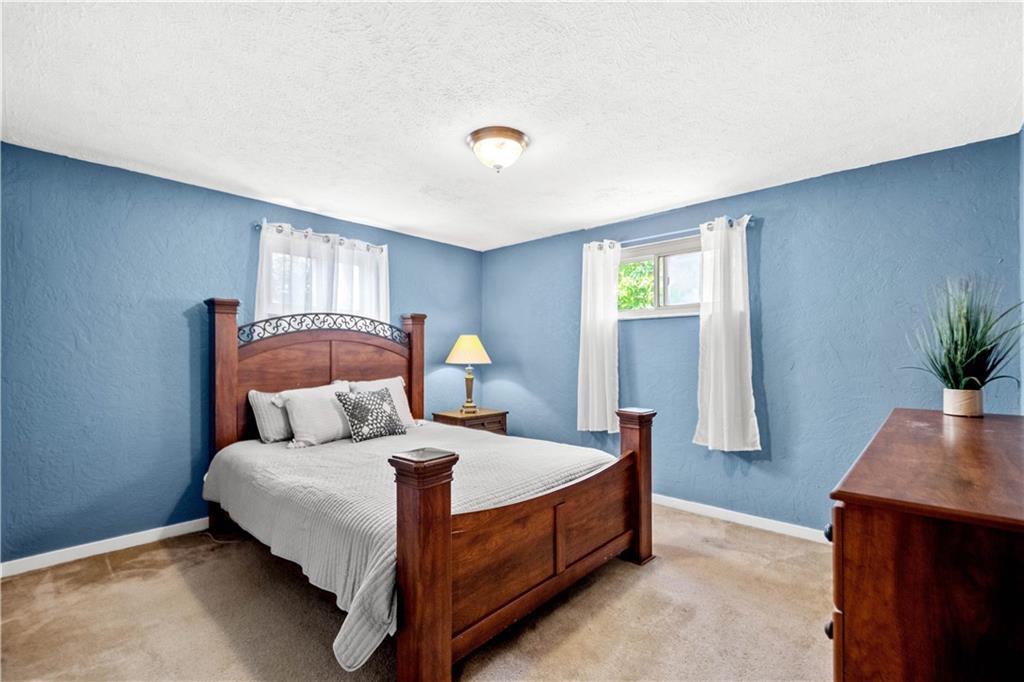 3406 McRoberts Road Pittsburgh, PA 15234 - Photo 7 of 19 a bedroom with a bed and window