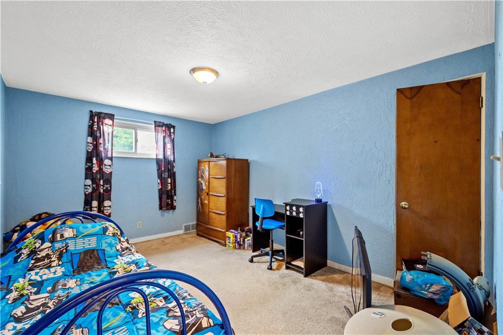 3406 McRoberts Road Pittsburgh, PA 15234 - Photo 8 of 19 a bedroom with bed and a window