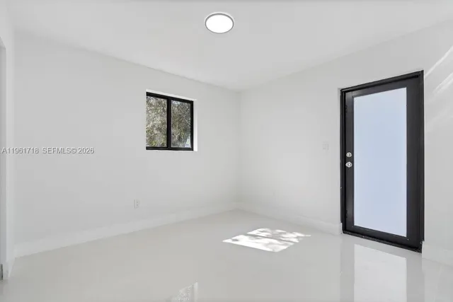 an empty room with a door