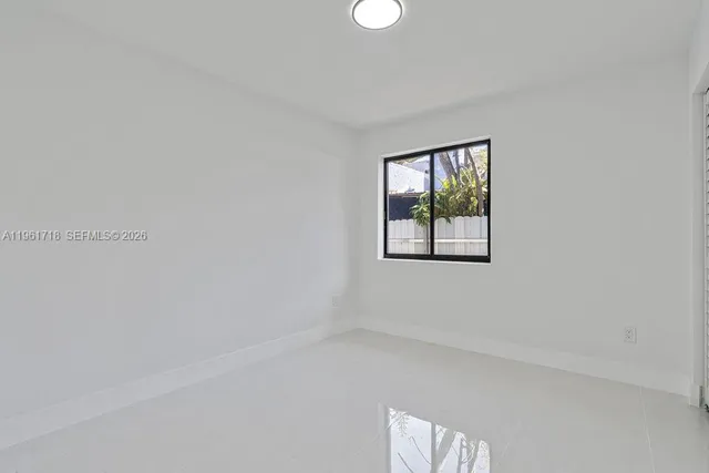 a view of empty room with windows