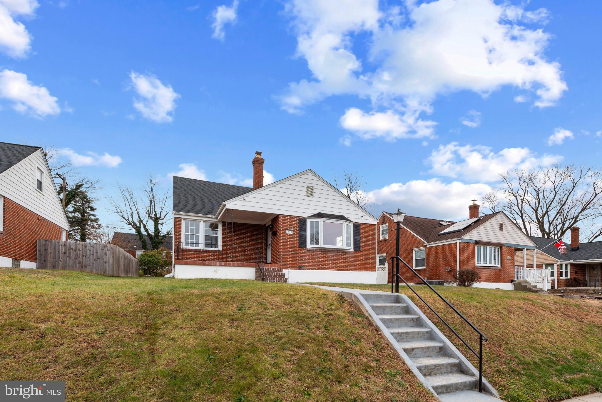 1817 Hanford Road Rosedale, MD 21237 - Photo 25 of 32 a front view of a house with a yard