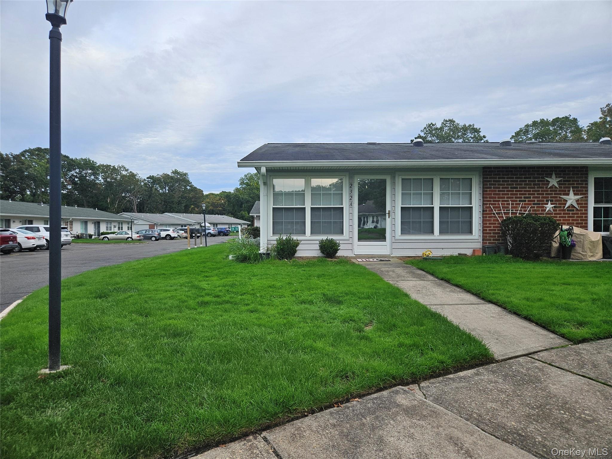 a view of a house with a yard and plants
