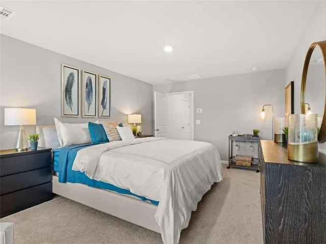 a bedroom with bed and wooden floor