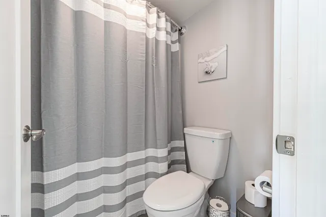 a bedroom with a large bed and a large window