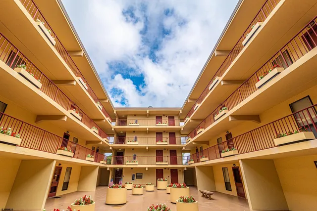 a front view of a building with swimming pool