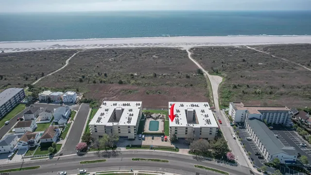 an aerial view of houses with outdoor space