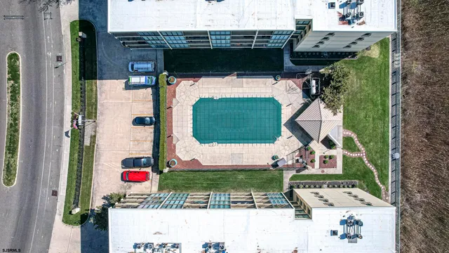a kitchen with white cabinets and appliances