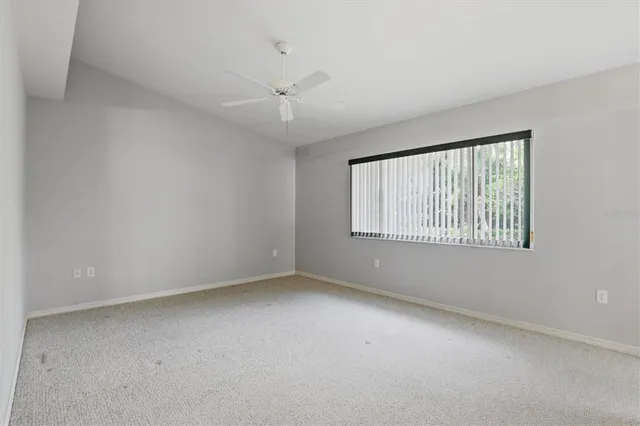a spacious bathroom with a double vanity sink toilet and a mirror