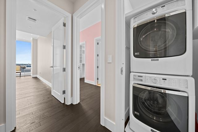 a view of a hallway with washer and dryer