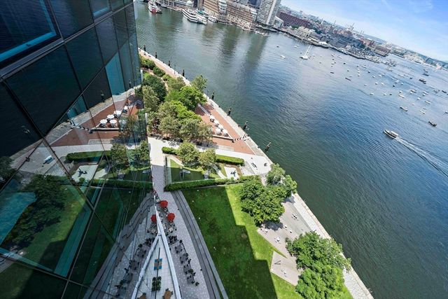 a view of a tall building next to a road