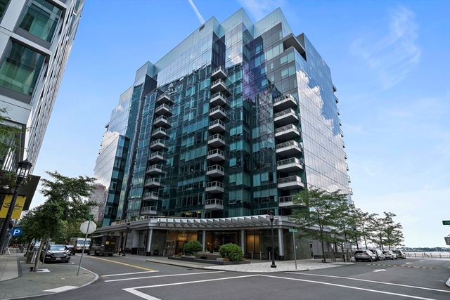an outdoor space with patio furniture and potted plants