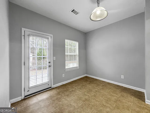 an empty room with windows