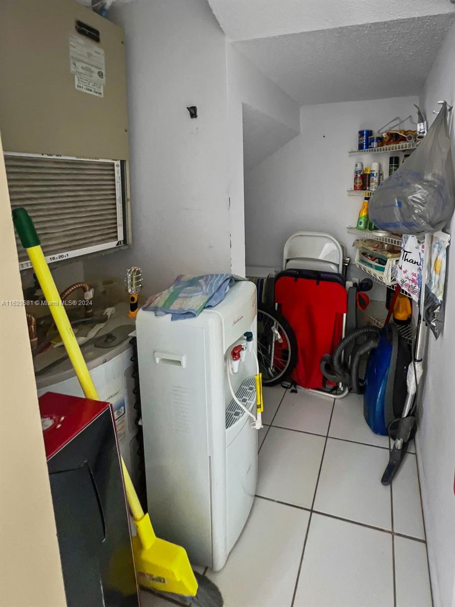 369 Waterside Drive, Unit 369 Hypoluxo, FL 33462 - Photo 12 of 23 a utility room with dryer and washer