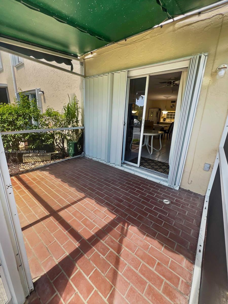 369 Waterside Drive, Unit 369 Hypoluxo, FL 33462 - Photo 14 of 23 a view of a backyard