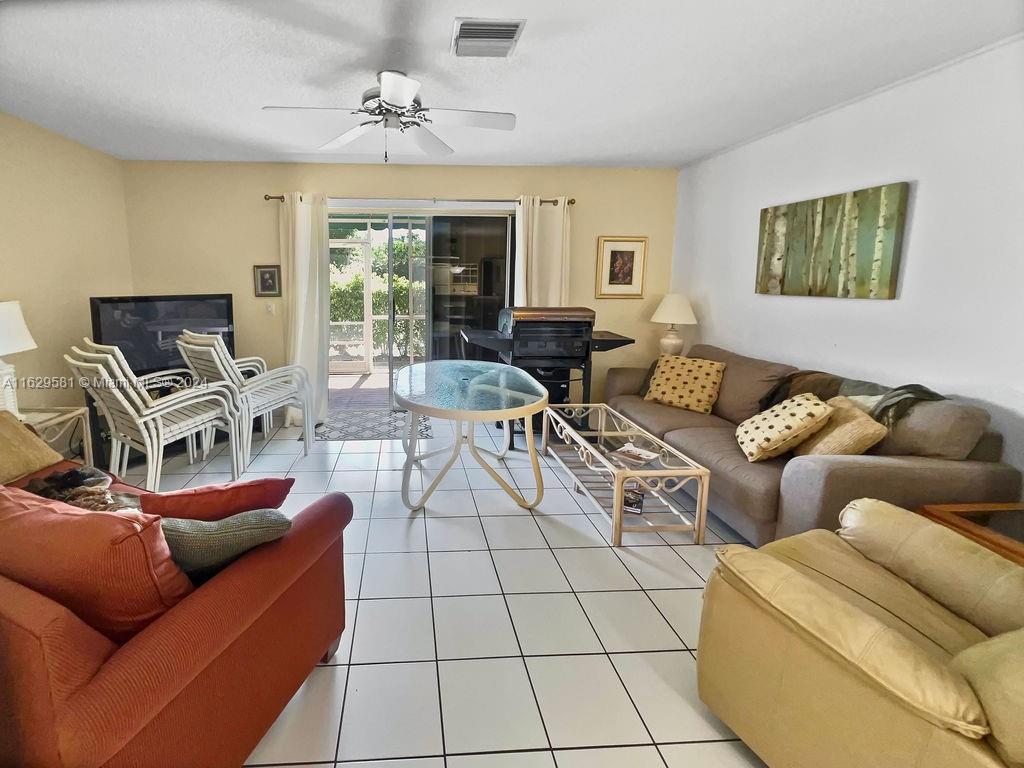 369 Waterside Drive, Unit 369 Hypoluxo, FL 33462 - Photo 23 of 23 a living room with furniture and a window
