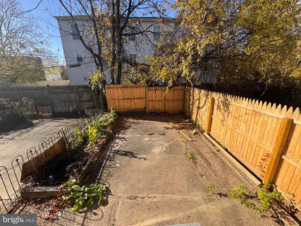 a view of a backyard of the house