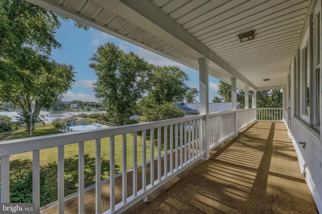 a view of a balcony with wooden floor