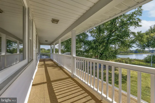 a view of balcony with couch and wooden floor