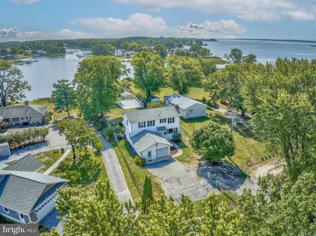 an aerial view of houses with yard