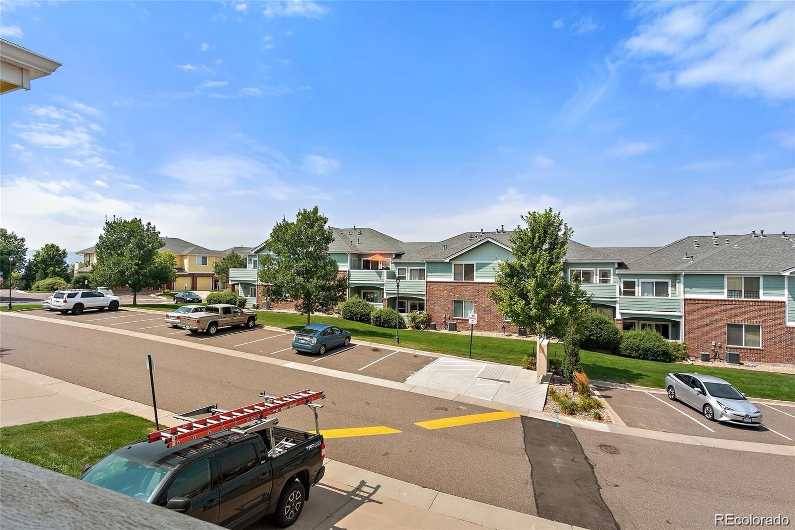 5534 Lewis Street, Unit 206 Arvada, CO 80002 - Photo 18 of 27 a view of a street with cars on the road