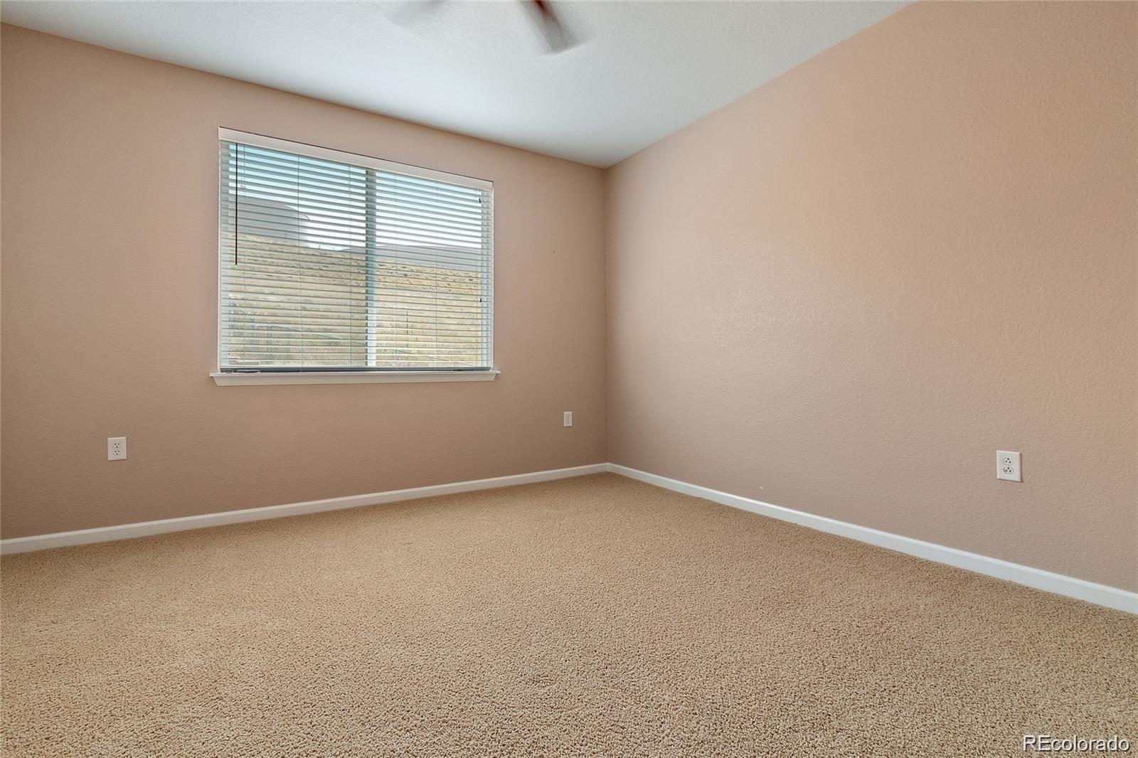 5534 Lewis Street, Unit 206 Arvada, CO 80002 - Photo 19 of 27 an empty room with a window