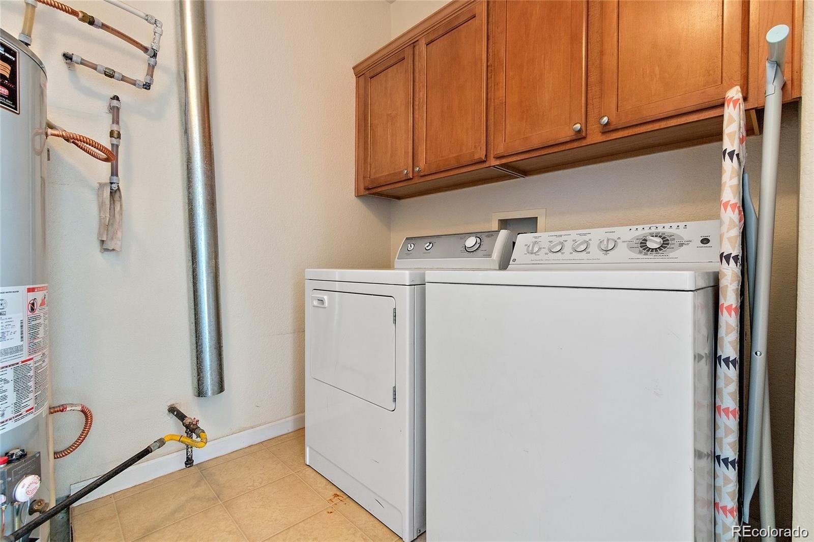 5534 Lewis Street, Unit 206 Arvada, CO 80002 - Photo 22 of 27 a utility room with dryer and washer