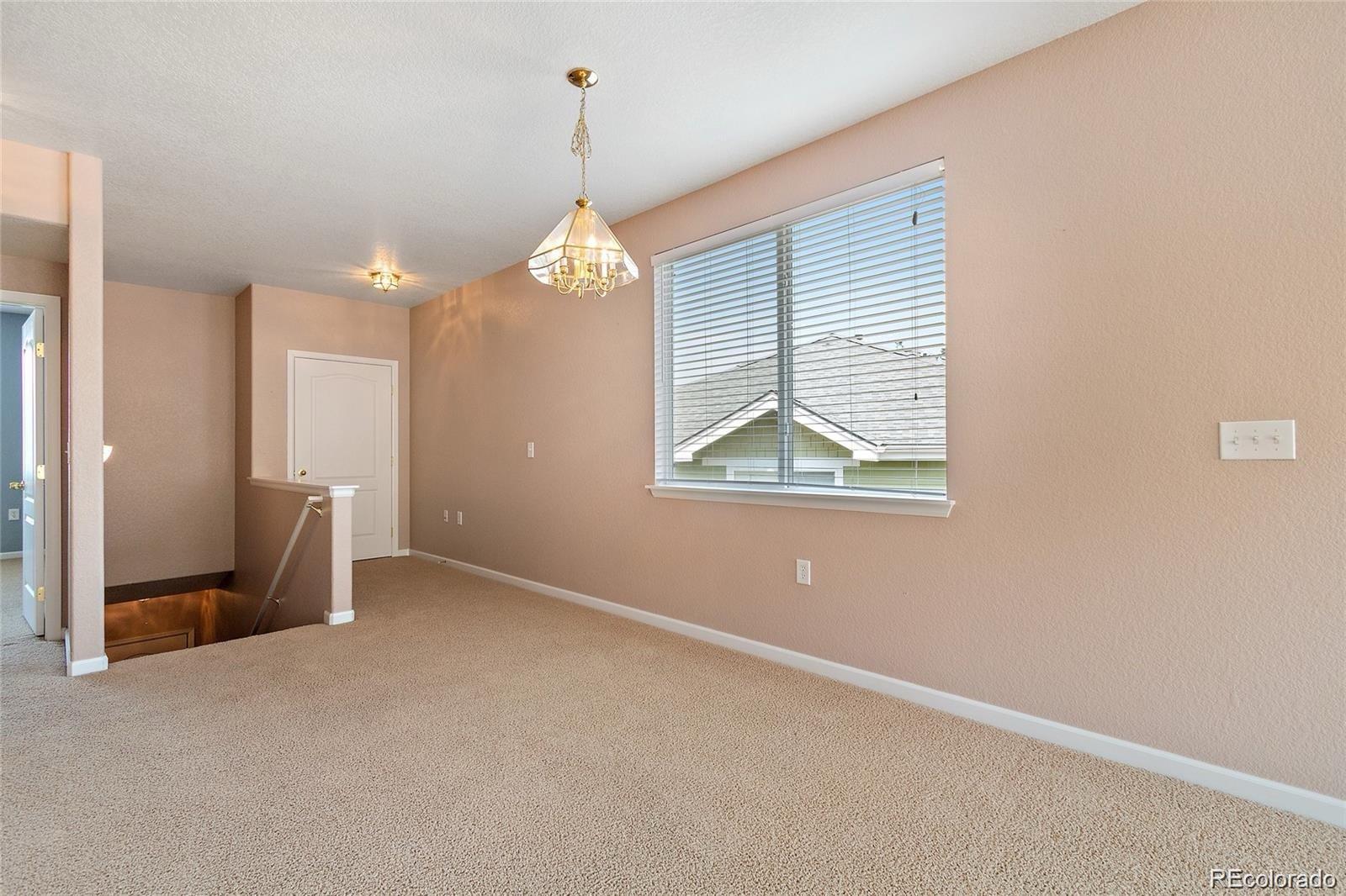 5534 Lewis Street, Unit 206 Arvada, CO 80002 - Photo 7 of 27 a view of livingroom with window