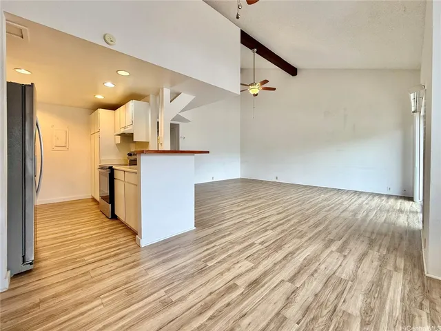 a view of kitchen and wooden floor