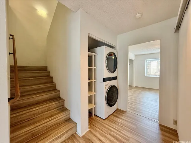 a view of a hallway with washer and dryer
