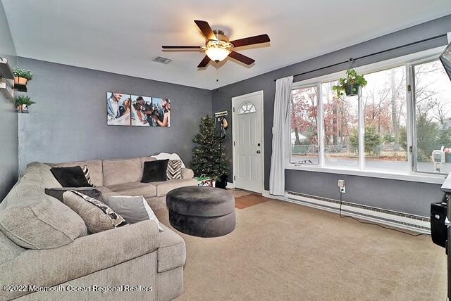329 Briggs Avenue Forked River, NJ 08731 - Photo 2 of 15 a living room with furniture and a large window