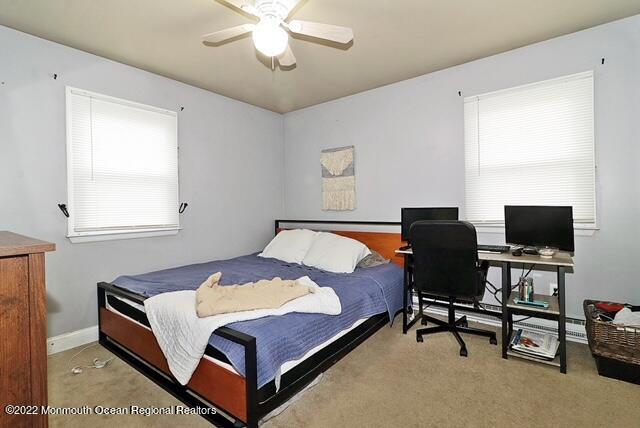 329 Briggs Avenue Forked River, NJ 08731 - Photo 12 of 15 a bedroom with a bed bookshelf and a computer on the desk
