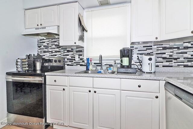 329 Briggs Avenue Forked River, NJ 08731 - Photo 5 of 15 a kitchen with appliances a sink and cabinets
