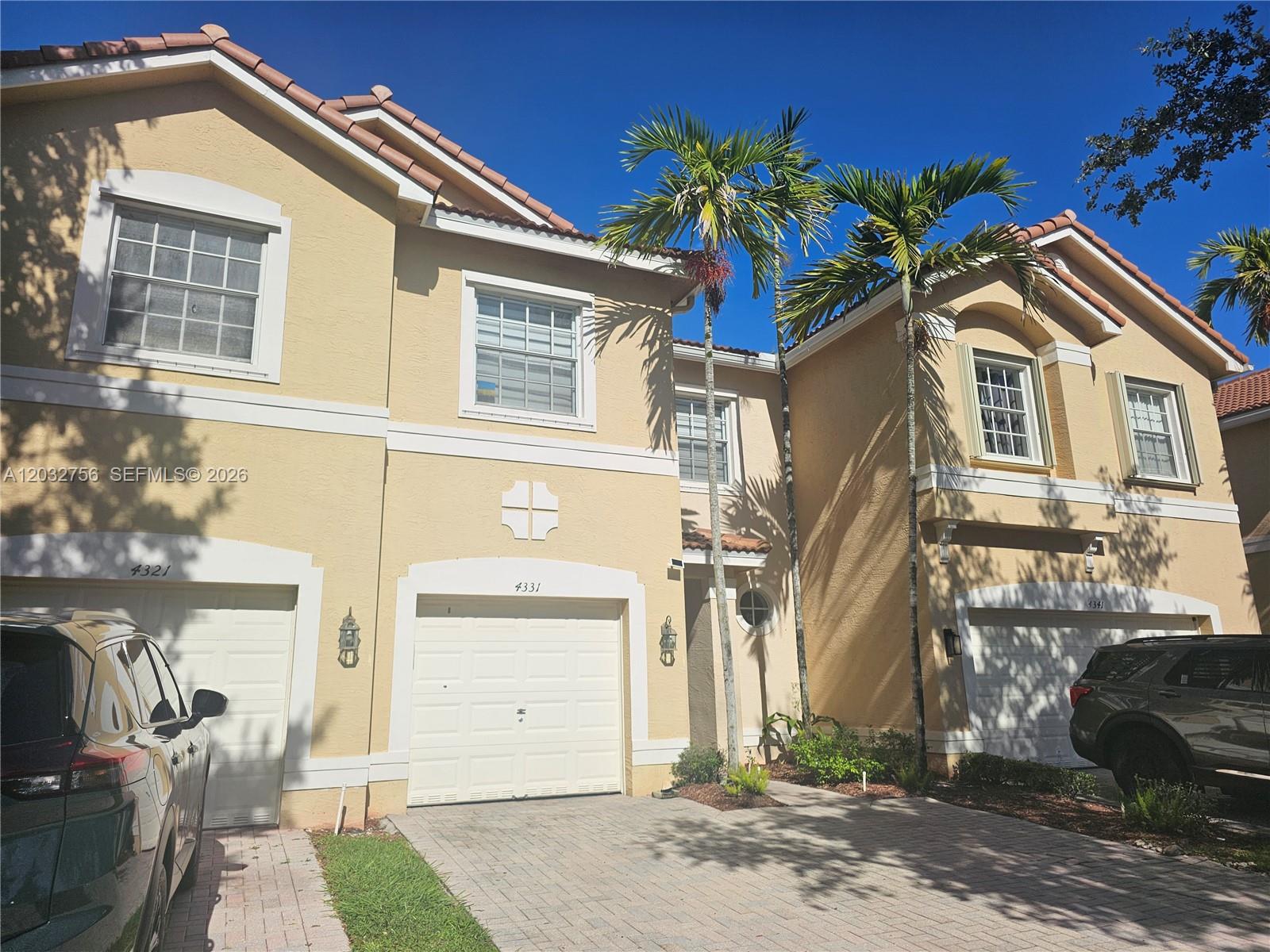 4331 Southwest 124th Way Miramar, FL 33027 - Photo 29 of 40 a front view of a house with a yard