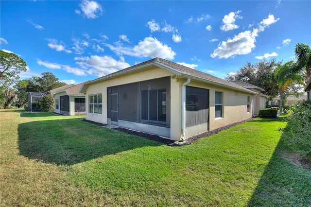 a living room with furniture a ceiling fan and a rug