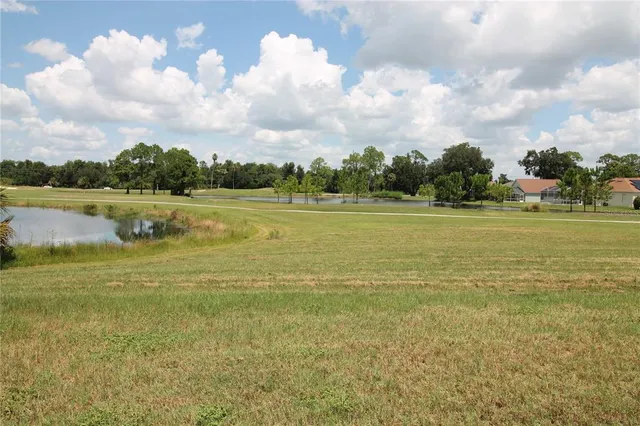 a kitchen with stainless steel appliances granite countertop a sink stove and microwave