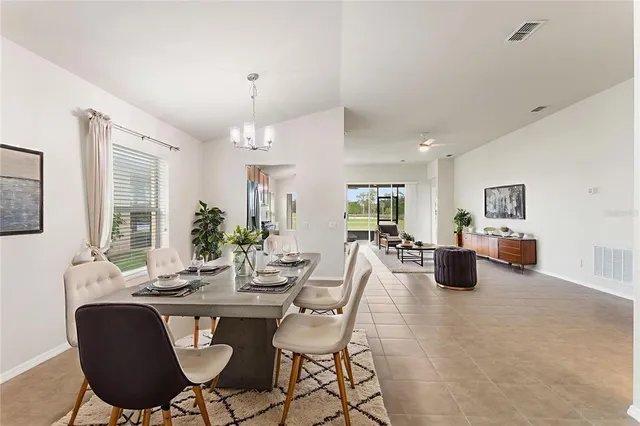 a bathroom with a bathtub shower sink mirror vanity and toilet