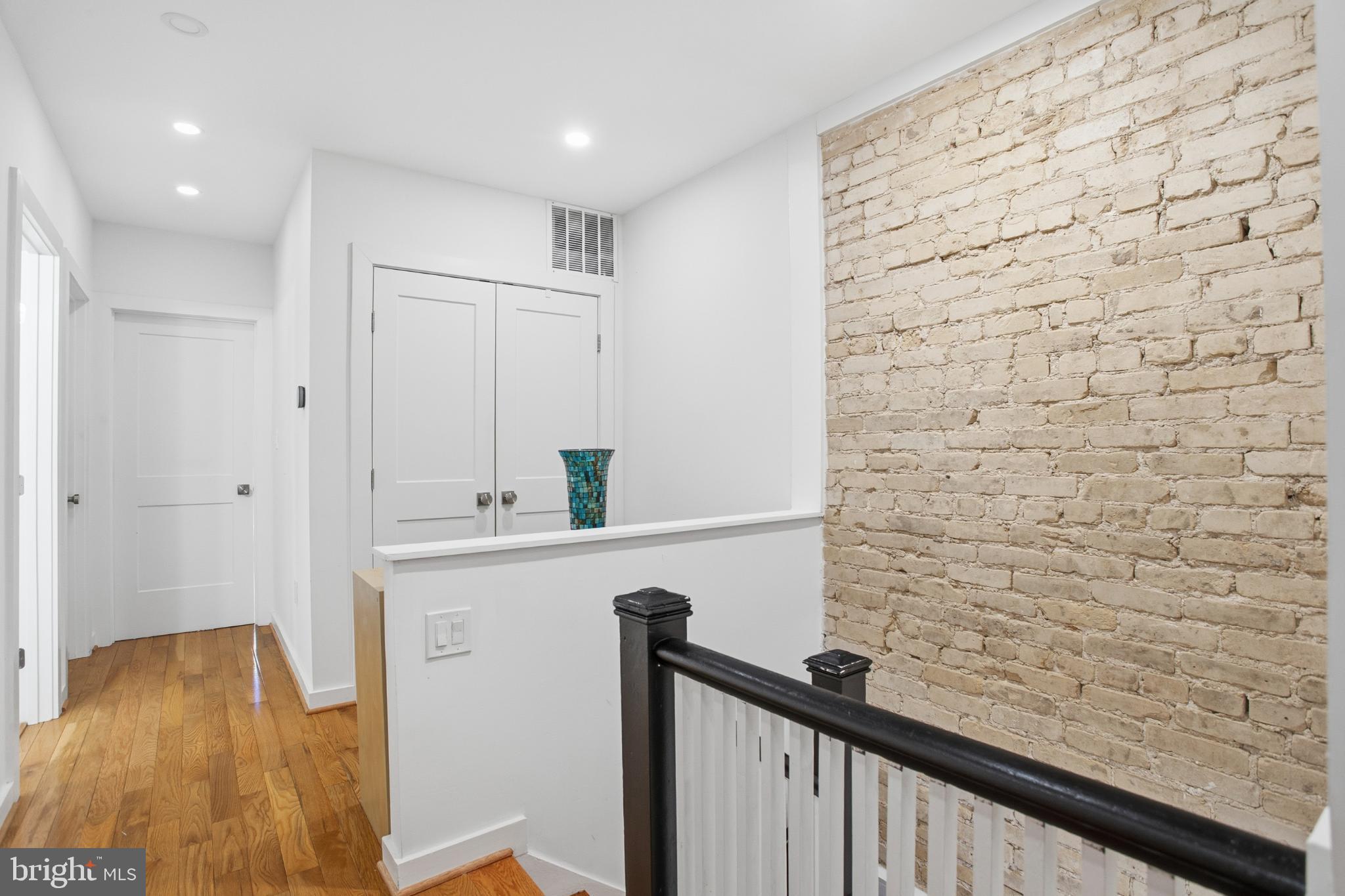 4903 9th Street Northwest Washington, DC 20011 - Photo 14 of 28 Charming hallway with exposed brick accent.