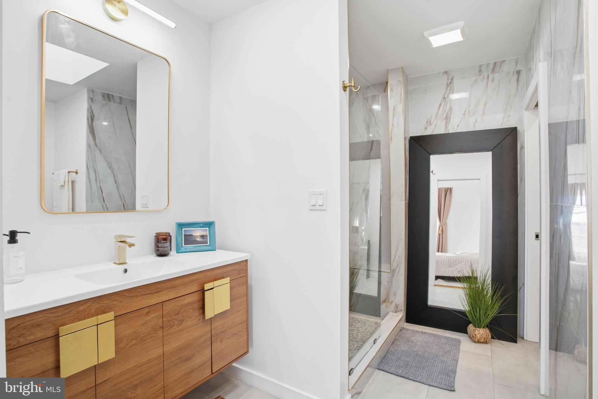 4903 9th Street Northwest Washington, DC 20011 - Photo 17 of 28 Sleek modern bathroom with elegant finishes.