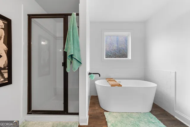 a white bath tub sitting in a bathroom