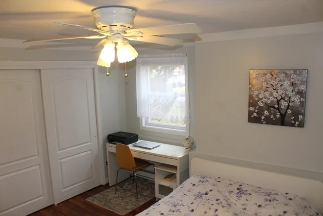 a room with a window and a chandelier