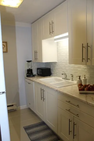 a bathroom with a sink and a window