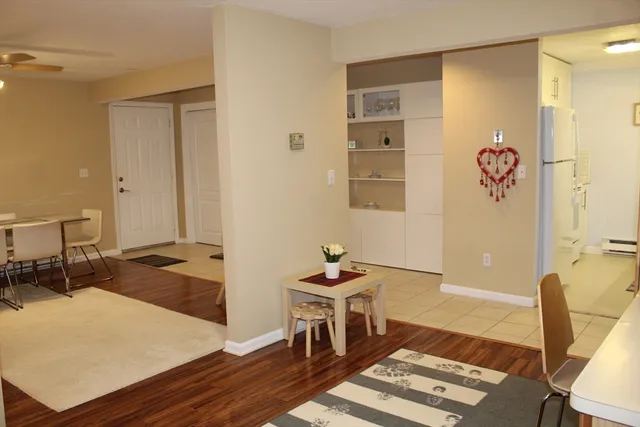 a living room with furniture a rug and a table