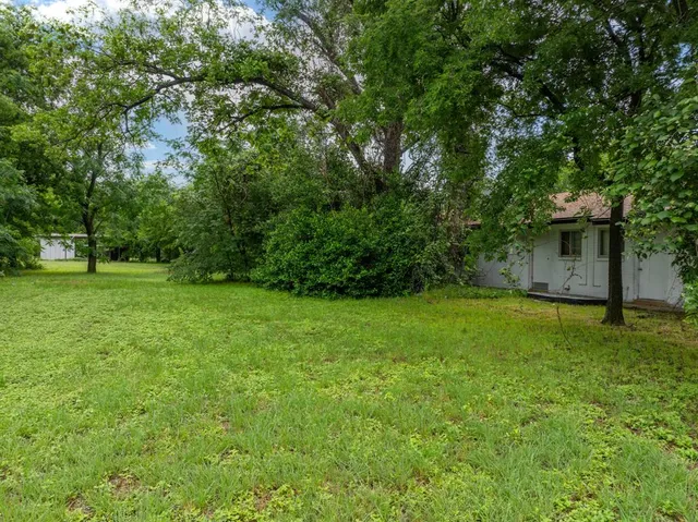 a view of a backyard with a garden