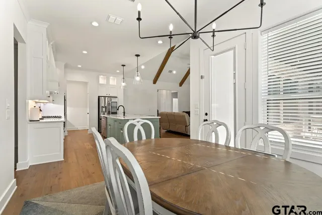 a lobby with a table and chairs