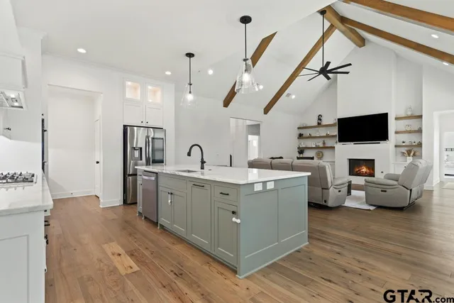 a view of living room with furniture and flat screen tv