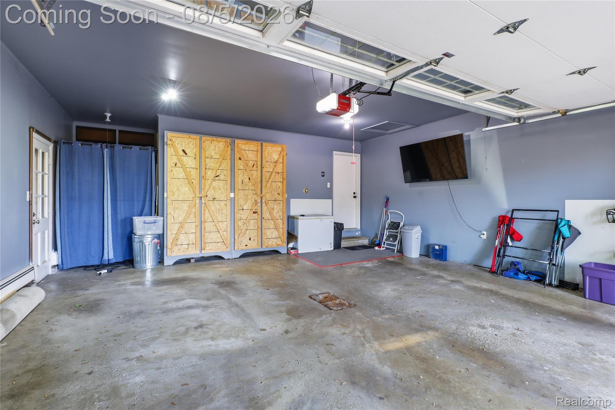 6478 West Stanley Road Mount Morris, MI 48458 - Photo 67 of 80 Attached garage featuring concrete flooring, overhead lighting, and two garage door openers