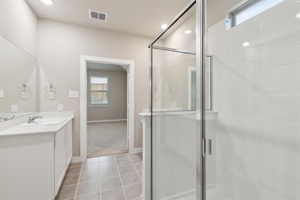 8308 Coastal Lane Pilot Point, TX 76258 - Photo 21 of 32 a bathroom with a shower and a sink
