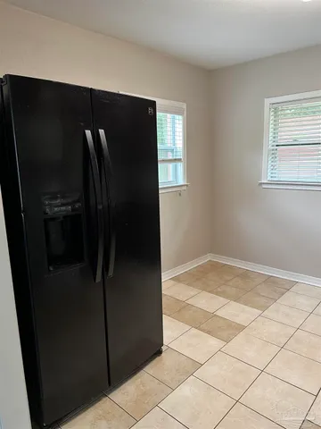 a view of a refrigerator in kitchen
