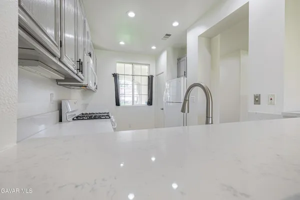 a view of a house with backyard and garden